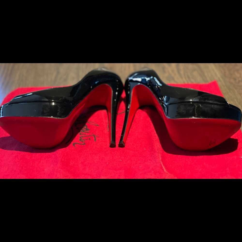 Louboutins Black Platform Pumps!
